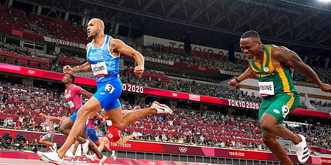 Lamont Jacobs (C) of Italy celebrates after winning the men's the 100-meter final at the 2020 Summer Olympics. (Photo | AP)