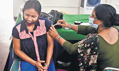 A beneficiary gets the first dose of COVID-19 jab at a vaccination centre in Delhi. (Photo | Parveen Negi, EPS)