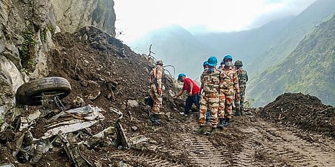 ITBP personnel during a search operation after a landslide on the Reckong Peo-Shimla Highway in Kinnaur district. (Photo | PTI)