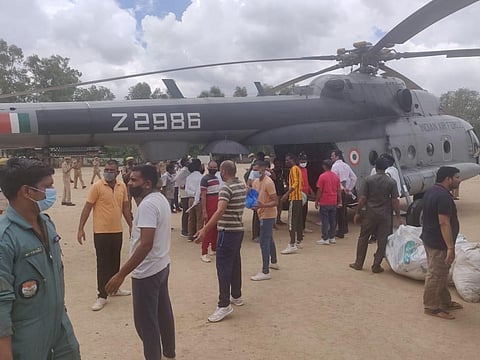 ndian AirForce helicopters carry out airlift of essentials and relief supplies for the population of #Jalaun district, Uttar Pradesh. (Photo | Twitter)