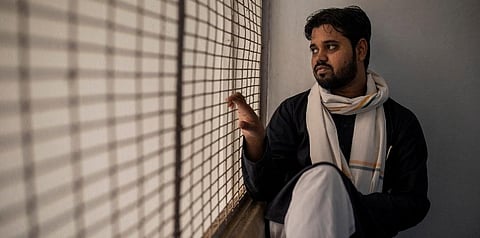 Asif Iqbal Tanha, 24, a student leader, looks out from a window at the Students Islamic Organisation of India headquarters in New Delhi, India, on Aug. 3, 2021. (File photo | AP)