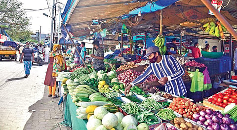 A vendor arranging items at a vegetable shop in Ernakulam on Thursday | Albin Mathew