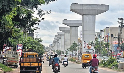 Motorists pass by the Uppal elevated corridor flyover which is under construction since 2018 | S Senbagapandiyan