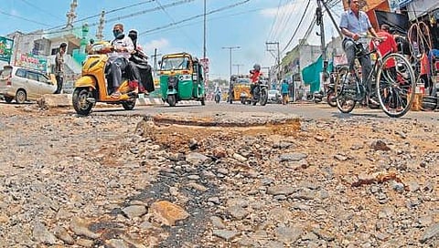 Damaged roads cause inconvenience to commuters at One Town in Vijayawada on Monday. (Photo | Prasant Madugula, EPS)
