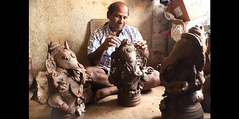 Umapathy making a Vinayagar idol at his house at Soolaimedu in Vellore district | S Dinesh