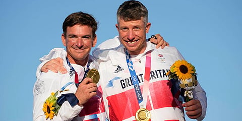 First placed Britain's Stuart Bithell and Dylan Fletcher celebrate at the end of the men's 49er medal race during the 2020 Summer Olympics in Fujisawa, Japan. (Photo | AP)