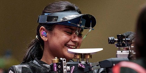 Avani Lekhara smiles on the range on her way to winning the Shooting Women's 10m AR Standing SH1 Final at the Asaka Shooting Range during the Tokyo 2020 Paralympic Games. (Photo | AP)