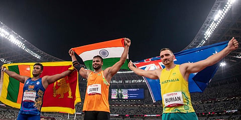 India's gold medalist Sumit Antil (C) pose for the cameras after the Men's Javelin Throw F44 during the Tokyo 2020 Paralympic Games in Tokyo. (Photo | AP)