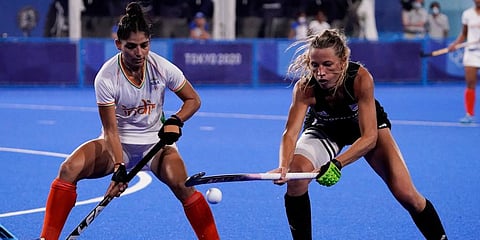 Argentina's Delfina Merino, right, and India's Udita, left, vie for the ball during a women's field hockey semi-final match at the 2020 Summer Olympics in Tokyo, Japan. (Photo | AP)