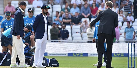 India's captain Virat Kohli (C) and England captain Joe Root (L) at the toss prior to the start on first day of the first Test cricket match, at Trent Bridge in Nottingham. (Photo | AP)