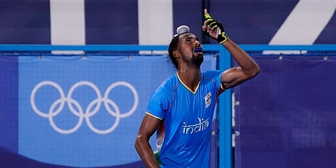 India's Hardik Singh celebrates after scoring during a men's field hockey match at the 2020 Summer Olympics in Tokyo, Japan. (Photo | AP)