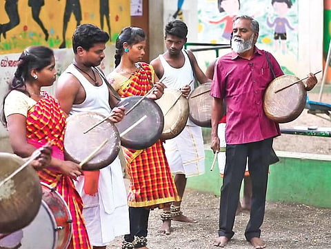 R Kaleeswaran with folk performers
