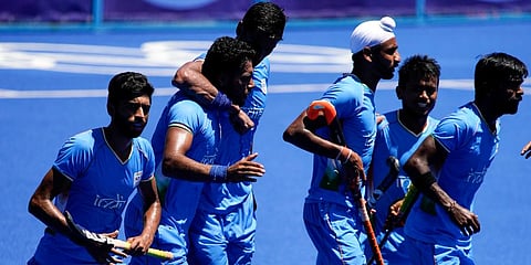 India players react after Harmanpreet Singh, second from left, scored on Germany during the men's field hockey bronze medal match at the 2020 Summer Olympics in Tokyo, Japan. (Photo | AP)