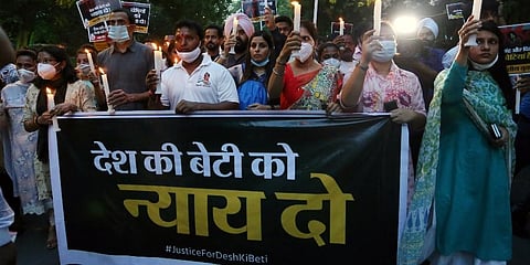 Indian Youth Congress activists during a candle march after a minor girl was allegedly raped and murdered, in New Delhi. (Photo | PTI)