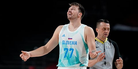 Slovenia's Luka Doncic (77) reacts to a foul call during men's basketball quarterfinal game against Germany at the 2020 Summer Olympics in Saitama, Japan. (Photo | AP)