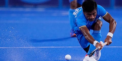 India's Nilakanta Sharma (18) passes against Japan during a men's field hockey match at the 2020 Summer Olympics in Tokyo, Japan. (Photo | AP)