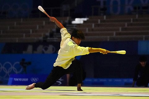 Male rhythmic gymnasts perform before the women's rhythmic gymnastics individual all-around final at the 2020 Summer Olympics. (Photo | AP)