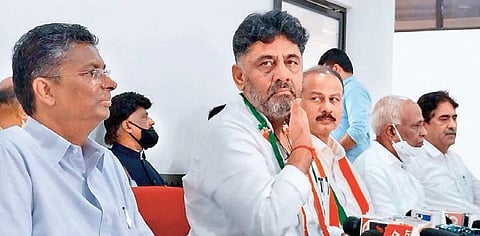 KPCC president DK Shivakumar addresses the media in Belagavi on Sunday. KPCC working president Satish Jarkiholi looks on | Express