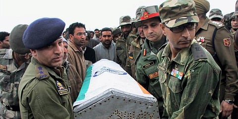 Army officers carry the coffin of para trooper who lost his life during an encounter with militants in Kupwara. (File Photo | PTI)