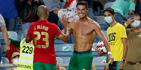 Portugal's Cristiano Ronaldo celebrates after scoring his side's second goal during the World Cup 2022 group A qualifying soccer match against Republic of Ireland at the Algarve Stadium. (Photo | AP)