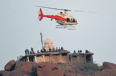 A heliopter hovers over Hampi during the Hampi Utsav last year | d hemanth