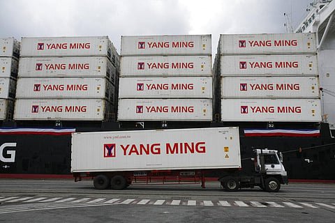In this Dec. 15, 2008, file photo, a Taiwanese shipping company loads containers on a ship in the harbor of Keelung, Taiwan. (Photo | AP)