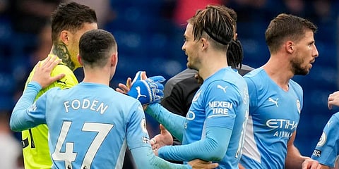 Manchester City players celebrate at the end of the EPL match against Chelsea at Stamford Bridge Stadium in London. (Photo | AP)