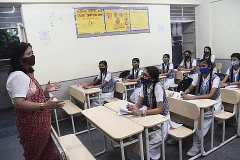 Students seen attending classes after the reopening of schools in New Delhi, on Wednesday. (Photo | Parveen Negi/EPS)