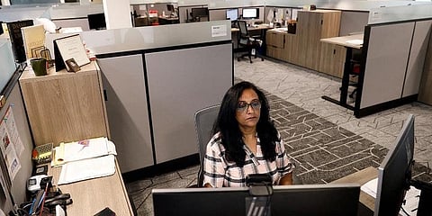 Image of an employee in an office space used for representation. (File Photo | AP)