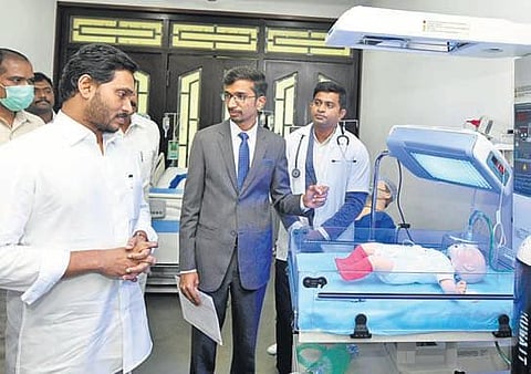 Andhra Pradesh CM YS Jagan Mohan Reddy inspects an equipment during the inauguration of 144 oxygen plants, at his camp office in Tadepalli on Monday, Jan 10, 2022. (Photo | Express)