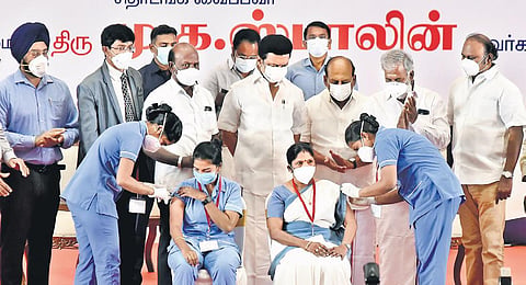 Chief Minister MK Stalin oversees healthcare workers administering booster dose to people in Chennai on Monday after launching the drive | P Jawahar