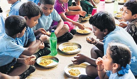 School children enjoy a meal of millets