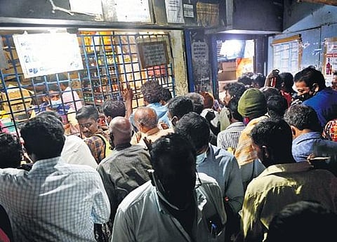 File photo of people crowding at a Tasmac outlet in Chennai | Express