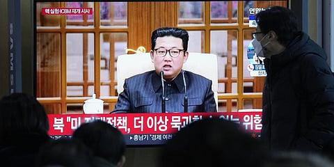 People watch a TV showing a file image of North Korean leader Kim Jong Un shown during a news program at the Seoul Railway Station in Seoul, South Korea, Thursday, Jan. 20, 2022.(Photo | AP)
