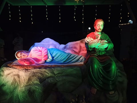 Blissful in Father's arms: The sculpture at St Mary's Church, Peringottukara shows St Joseph cradling baby Jesus in his arms