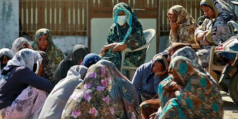 Relatives of four family members, who froze to death near the Canada-US border, gather to mourn the deaths at Dingucha village. (Photo| Special Arrangement)
