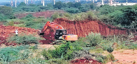 Brick kiln operators levelling the ground in Thadagam Valley. (File photo| EPS)