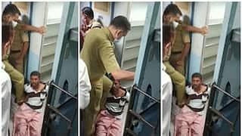 Still from the video captured by a co-passenger showing the ASI thrashing the passenger.