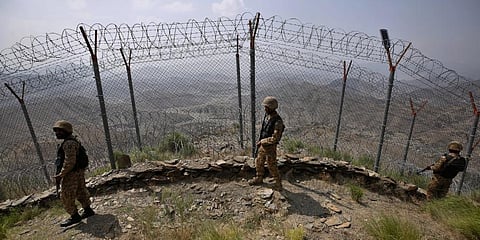 Pakistan Army troops patrol along the fence on the Pakistan Afghanistan border. (Photo | AP)