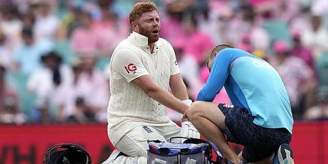 England's Jonny Bairstow has an injury to his thumb attended to during the third day of their Ashes cricket test match against Australia in Sydney, Friday, Jan. 7, 2022. (Photo |AP)