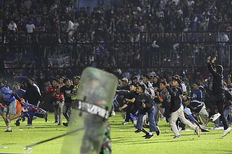 At least 133 people died at an Indonesian football stadium riot in which thousands of angry home fans invaded the pitch and police responded with tear gas that triggered a stampede.(Photo | AP)