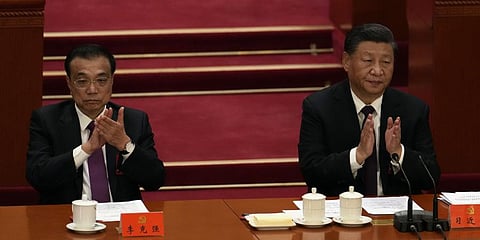 Chinese President Xi Jinping, right, and Premier Li Keqiang attend the closing ceremony of the 20th National Congress of China's ruling Communist Party in Beijing. (Photo | AP)