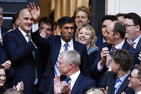 Rishi Sunak, top centre, waves after winning the Conservative Party leadership contest at the Conservative party Headquarters in London, Monday, Oct. 24, 2022. (Photo | AP)