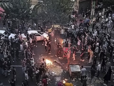 Iranians protest over the death of 22-year-old woman Mahsa Amini after she was detained by the morality police, in Tehran, Sept. 20, 2022. (File Photo | AP)