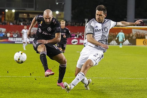 Toronto FC defender Shane O'Neill, right, blocks a shot by Inter Miami forward Gonzalo HiguaĂn (10) during the first half of an MLS soccer match Friday, Sept. 30, 2022 in Toronto. (Photo | AP)