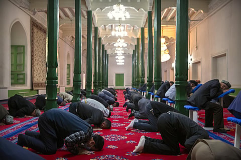Uyghurs and other members of the faithful pray at the Id Kah Mosque in China's Xinjiang Uyghur Autonomous Region, as seen during a government organized trip for foreign journalists. (File Photo | AP)
