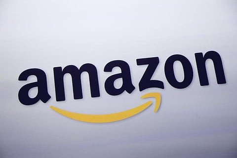 The Amazon logo is displayed at a news conference in New York on Sept. 28, 2011. (Photo | AP)
