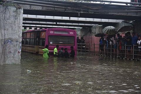 A Metropolitan Transport Corporation (MTC) bus struck in the flooded Ganeshapuram subway at vyasarapadi following heavy rains in Chennai on Tuesday, November 1, 2022. (Photo | EPS, P Jawahar)