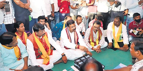 Union Minister Dharmendra Pradhan, BJP Padampur candidate Pradip Purohit and Bargarh MP Suresh Pujari with farmers | Express