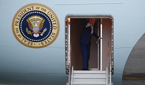 US President Joe Biden waves as he boards Air Force One to return to Washington after attending the G20 Leaders' summit in Bali, Indonesia, Wednesday Nov. 16, 2022. (Photo | AP)
